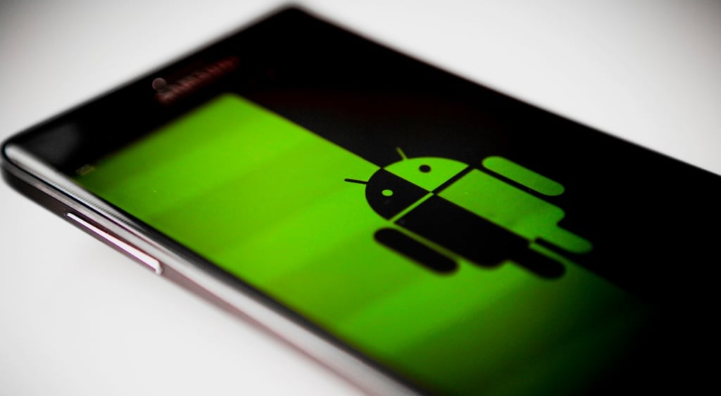 samsung smartphone, dark black and green screen with android mascot