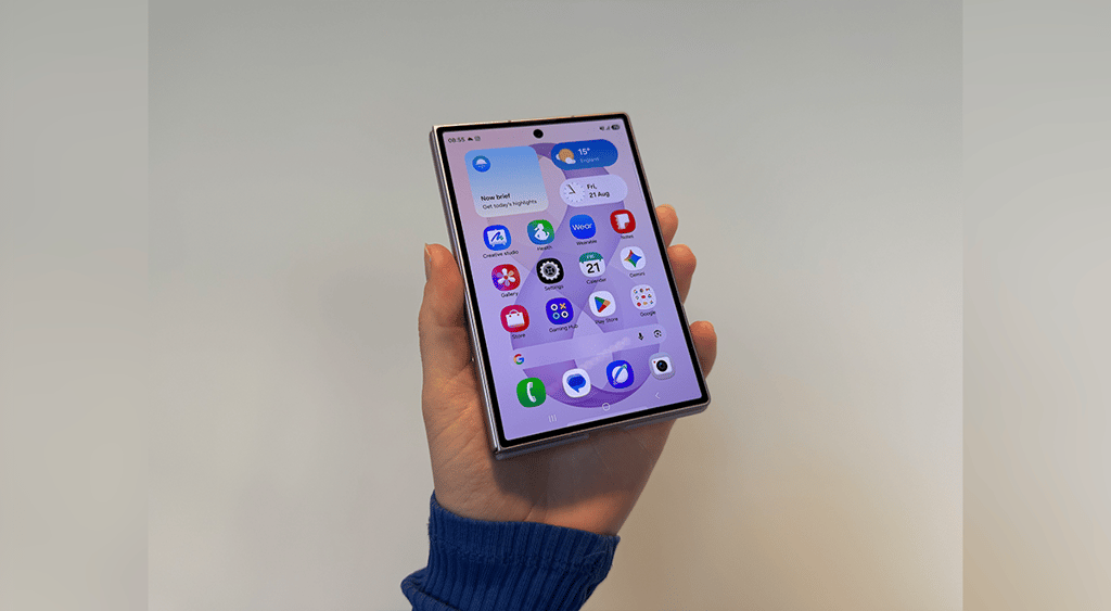 A hand holding Samsung Galaxy Z Fold8 with a display on.