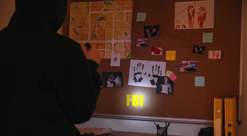 Criminal in FBI agent's office at night