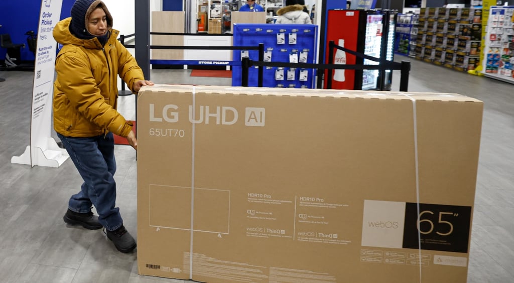 red tv box, LG UHD AI, shopper in dark yellow jacket, dark blue hood, jeans