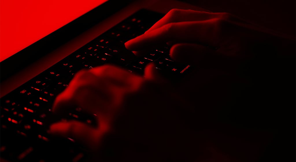 fingers on a laptop keyboard