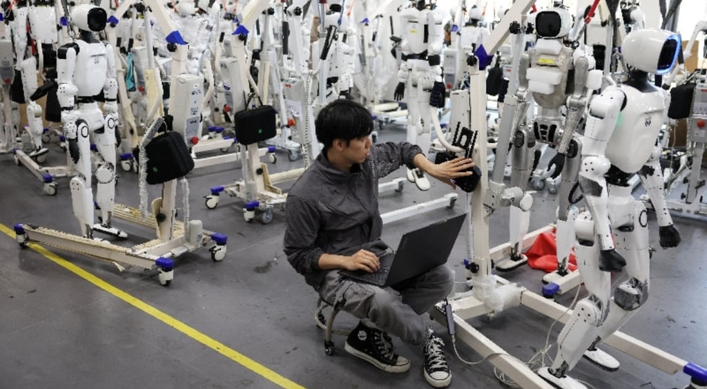 Engineer among Tiangong Omni robots in research and testing area in Beijing