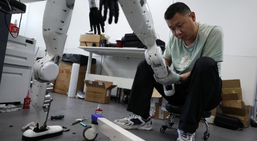 Engineer works on Tiangong Omni robot's leg
