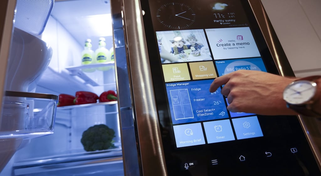 An employee uses Samsung smart fridge manager