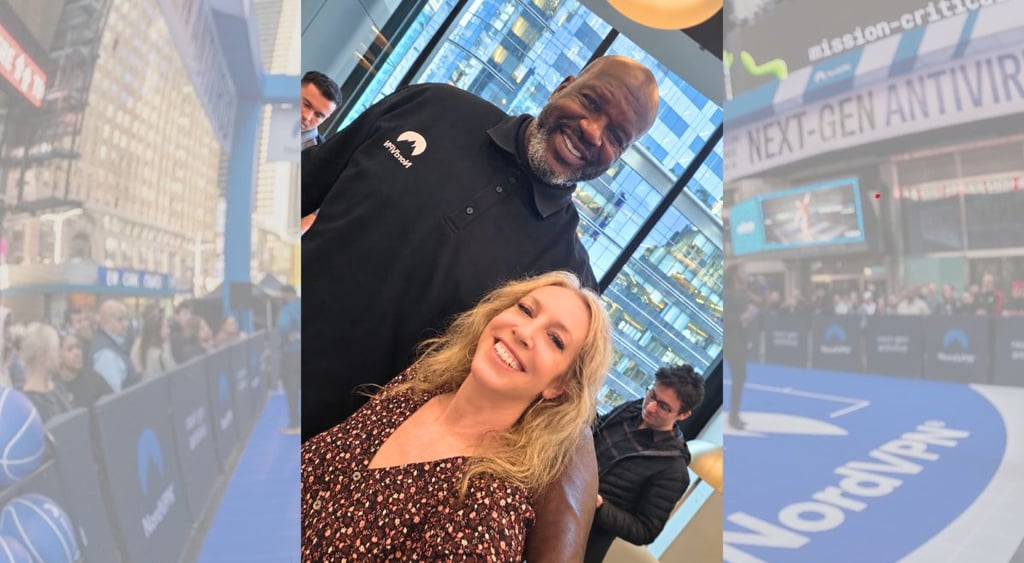 Stefanie takes selfie with Shaq at the NordVPN Times Square event.