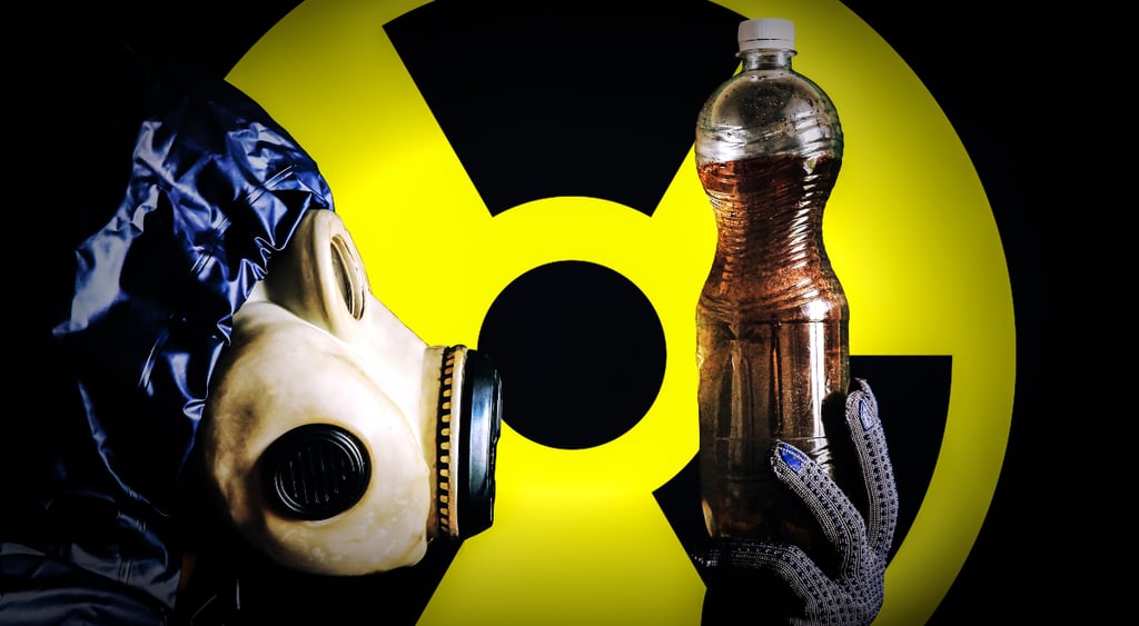 A man in a gas mask holds plastic bottle with dirty water