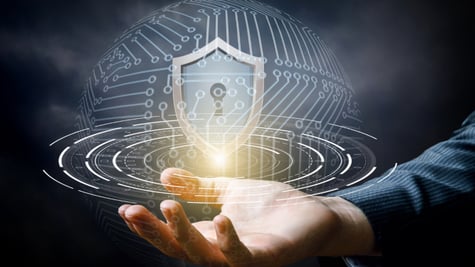 Hand showing the shield for protecting information systems.