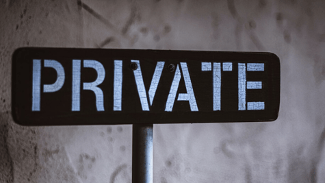 a sign in grey background which says private