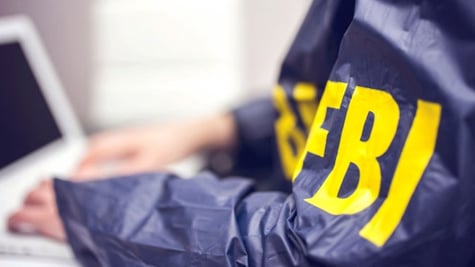 fbi agent using a laptop