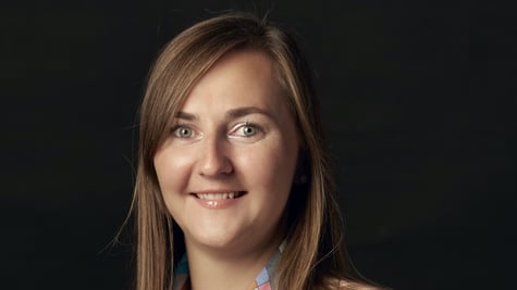 A portrait of a woman in a black background