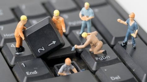 miniature people Work on Computer Keyboard