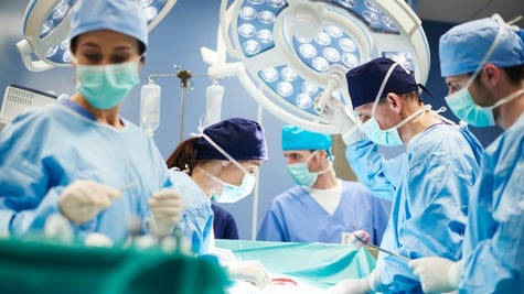 Group of surgeons in operating room