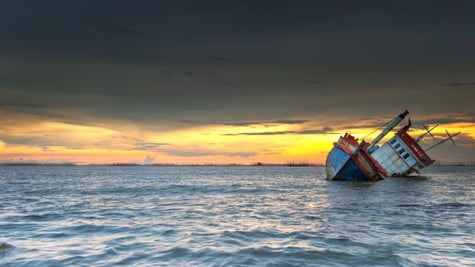 Sinking boat in the ocean