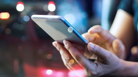 Woman holding mobile phone