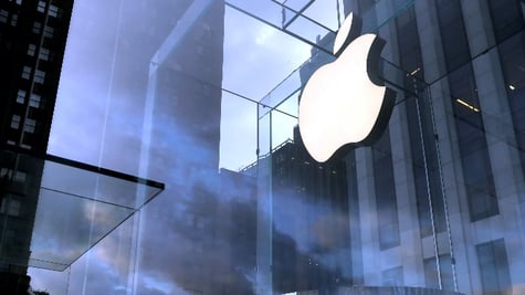 The Apple Inc. logo is seen hanging at the entrance to the Apple store on 5th Avenue in Manhattan