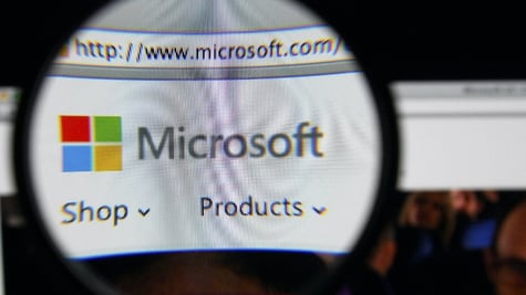 Microsoft logo through a magnifying glass