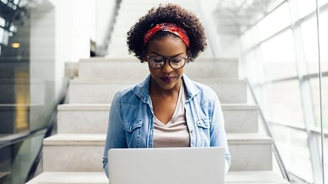 woman studying cybersecurity materials