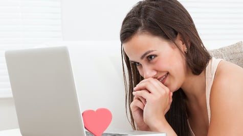 woman staring at a screen