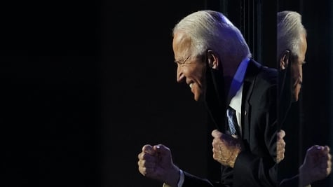 Democratic 2020 U.S. presidential nominee Joe Biden celebrates onstage at his election rally, after 