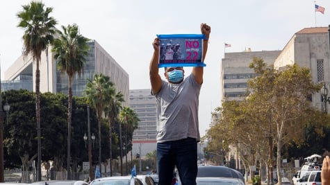 Man holding poster