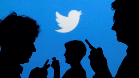 people with phones, twitter logo