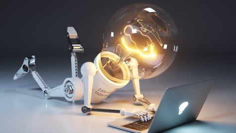 Light bulb as robot lying and using pc