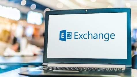 Laptop computer displaying logo of Microsoft Exchange, a mail server and calendaring server develope