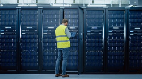 Man standing near cable cabinet
