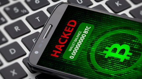 Bitcoin wallet hacked message on smart phone screen