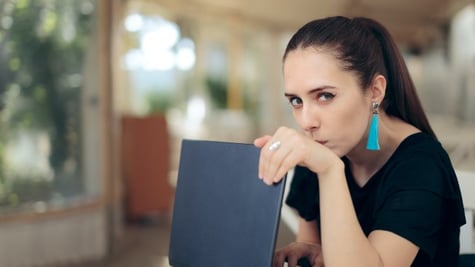 Woman with Laptop Worried About Online Privacy of Personal Data
