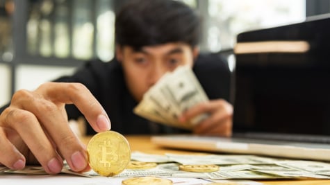 Man holding Bitcoin