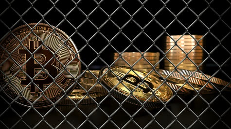 Bitcoin behind fence. Crypto ban concept