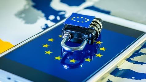 Padlock over a smartphone and EU map