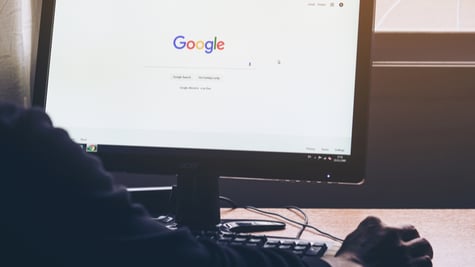 Man on a computer Browsing Google
