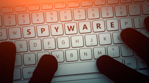 SPYWARE inscription on laptop keyboard