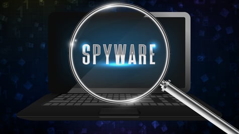 Magnifying glass by the computer detecting spyware