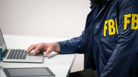 FBI agent working with a computer