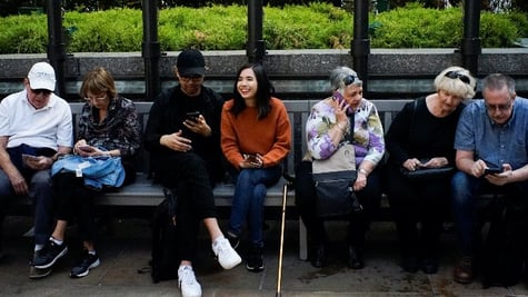 people looking at their phones