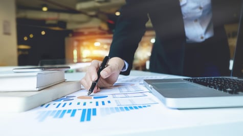 Business woman pointing to business documents