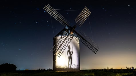 Don Quixote tilting at a windmill
