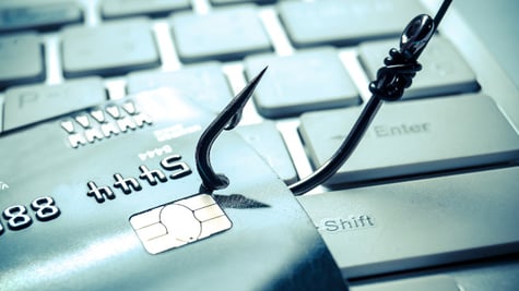 Credit cards on a fishing hook. Phishing attack concept