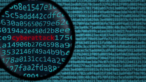 Data through magnifying glass. Ransomware/cyberattack concept