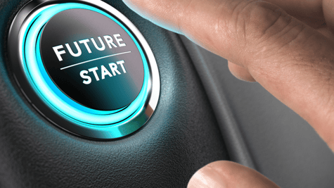 Finger reaching for Future/Start button in a car. Automotive industry breakout