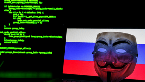V for Vendetta mask against Russian flag on laptop with Matrix style coding in background
