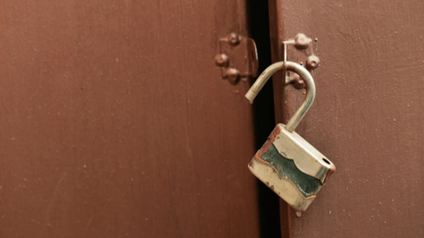 Open padlock and door