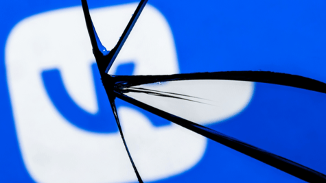VK logo seen through shattered glass