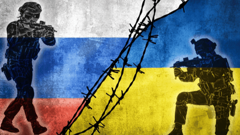 Flags of Russian and Ukraine divided by barb wire with soldiers pointing weapons at each other.