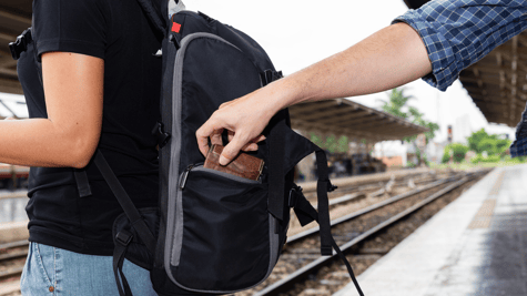Tourist getting wallet pinched from her backpack