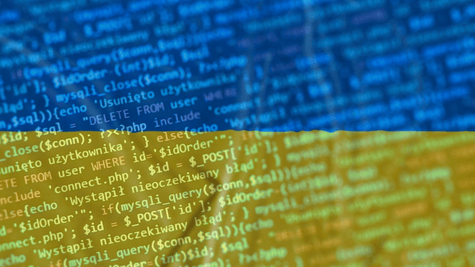Ukrainian flag in close-up, with computer coding superimposed