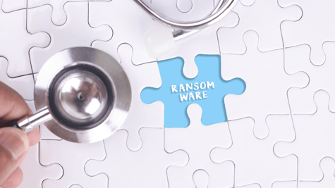 Physician's stethoscope above jigsaw puzzle saying ransomware